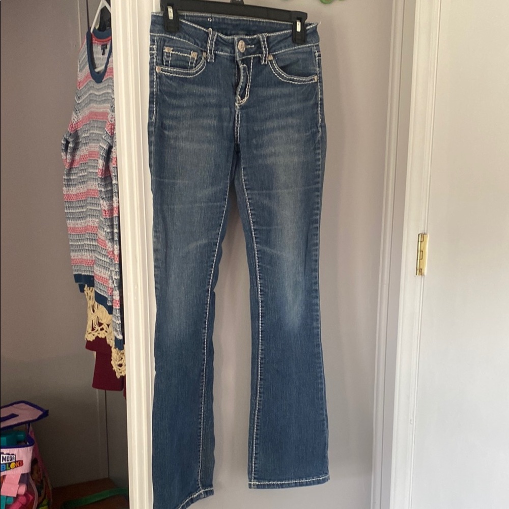 Denim Couture light wash with bling pockets and white stitching boot cut.